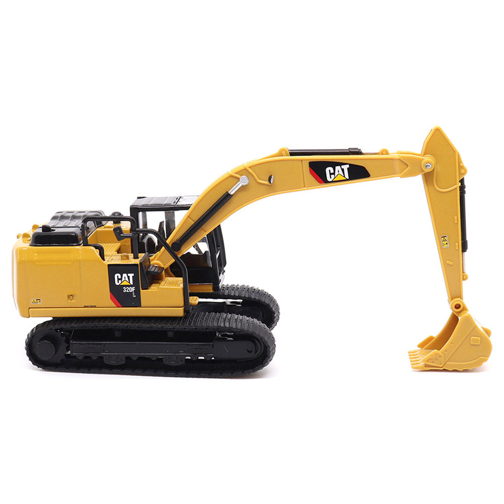 Yellow toy excavator with Caterpillar logo on a white background