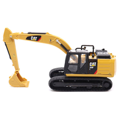 Yellow toy excavator with Caterpillar logo on a white background