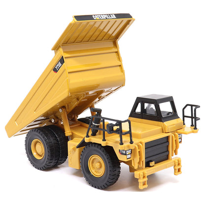 1:64 Scale Diecast Model of a Yellow and Black Caterpillar 775E Mining Dump Truck on a White Background