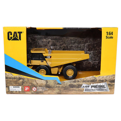 CAT 775E 1:64 scale metal construction dump truck toy in its original yellow and black retail packaging box.