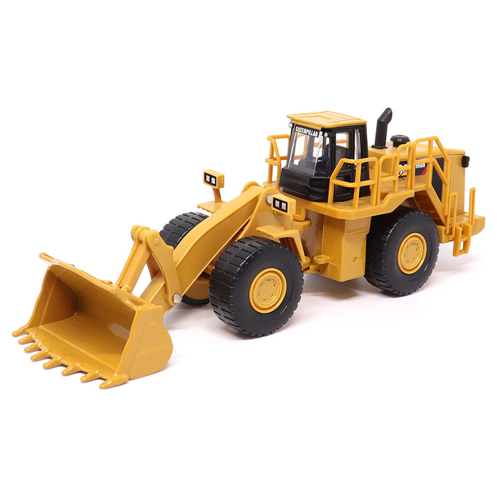 1:64th Scale Model of a CAT Yellow and Black Caterpillar 988H Wheel Loader on a White Background