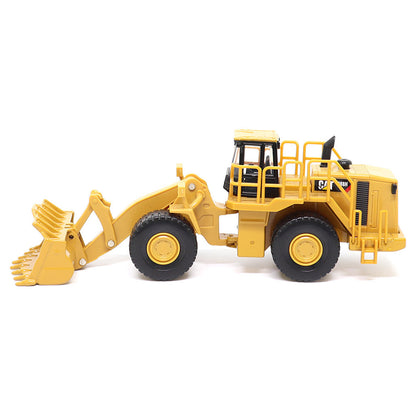 1:64th Scale Model of a CAT Yellow and Black Caterpillar 988H Wheel Loader on a White Background