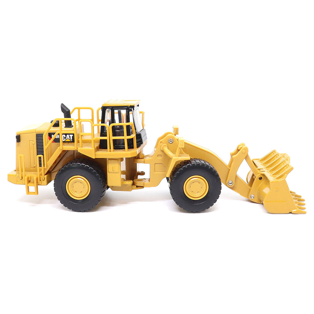 1:64th Scale Model of a CAT Yellow and Black Caterpillar 988H Wheel Loader on a White Background