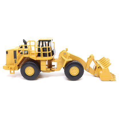1:64th Scale Model of a CAT Yellow and Black Caterpillar 988H Wheel Loader on a White Background