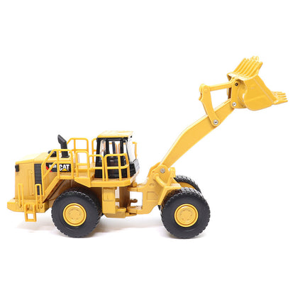1:64th Scale Model of a CAT Yellow and Black Caterpillar 988H Wheel Loader on a White Background
