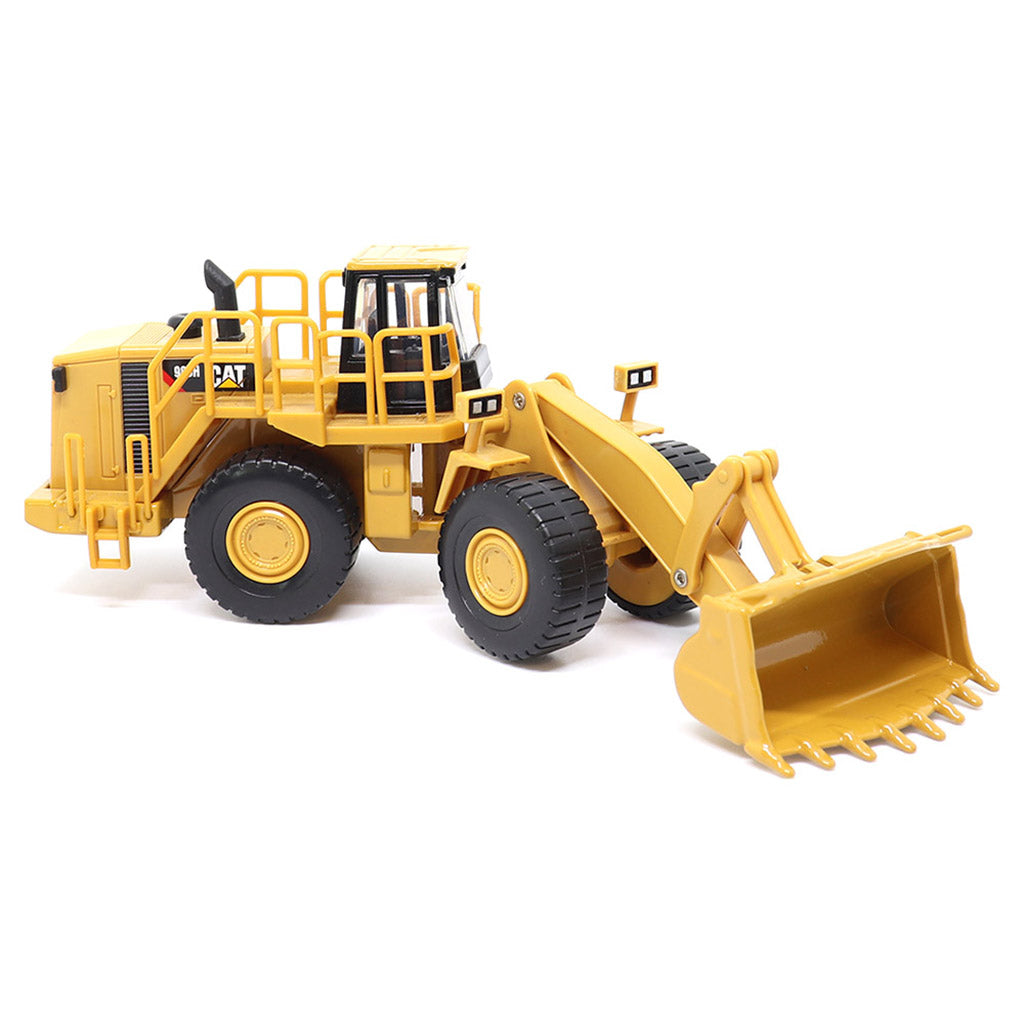 1:64th Scale Model of a CAT Yellow and Black Caterpillar 988H Wheel Loader on a White Background