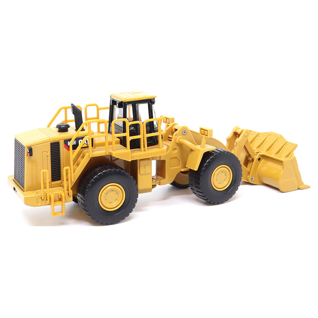 1:64th Scale Model of a CAT Yellow and Black Caterpillar 988H Wheel Loader on a White Background