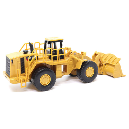 1:64th Scale Model of a CAT Yellow and Black Caterpillar 988H Wheel Loader on a White Background