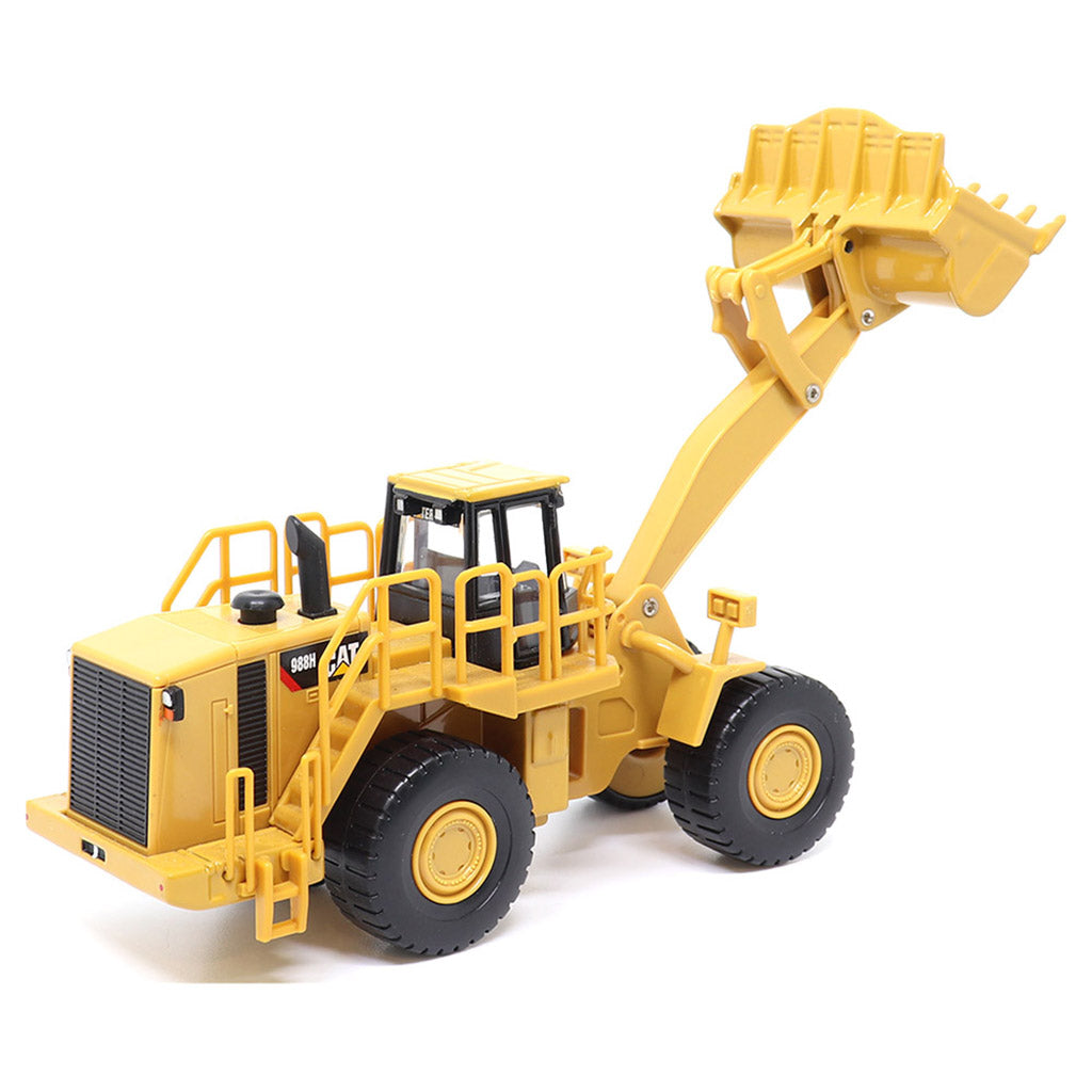 1:64th Scale Model of a CAT Yellow and Black Caterpillar 988H Wheel Loader on a White Background