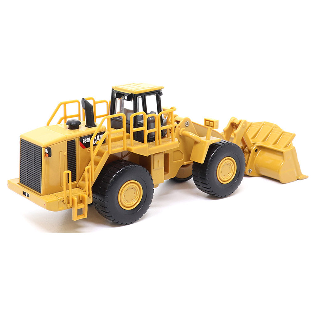 1:64th Scale Model of a CAT Yellow and Black Caterpillar 988H Wheel Loader on a White Background