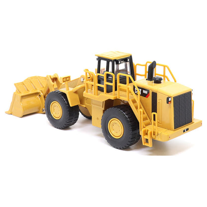 1:64th Scale Model of a CAT Yellow and Black Caterpillar 988H Wheel Loader on a White Background