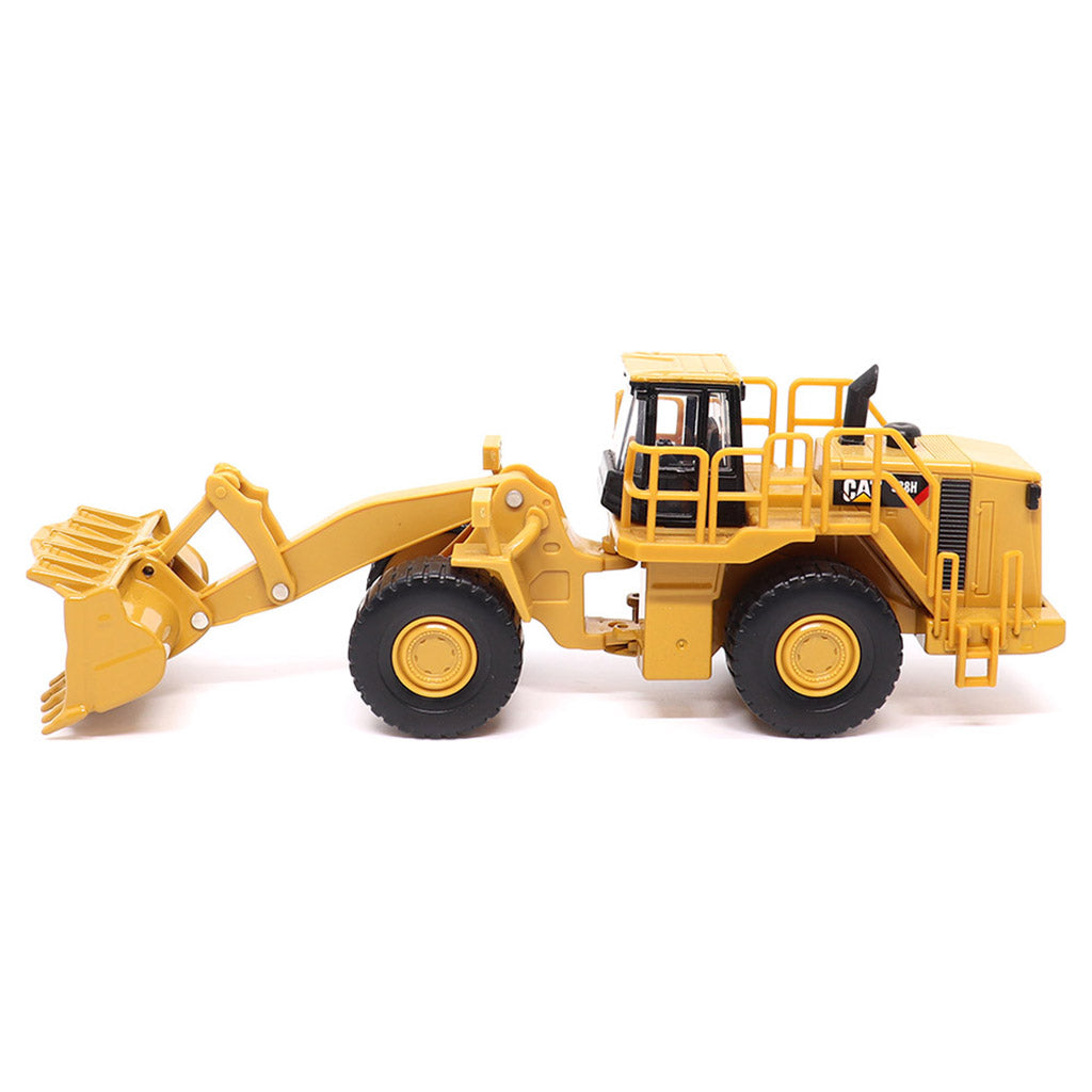 1:64th Scale Model of a CAT Yellow and Black Caterpillar 988H Wheel Loader on a White Background