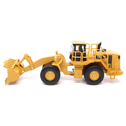 1:64th Scale Model of a CAT Yellow and Black Caterpillar 988H Wheel Loader on a White Background