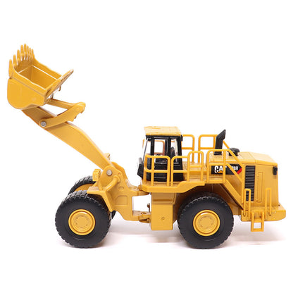 1:64th Scale Model of a CAT Yellow and Black Caterpillar 988H Wheel Loader on a White Background