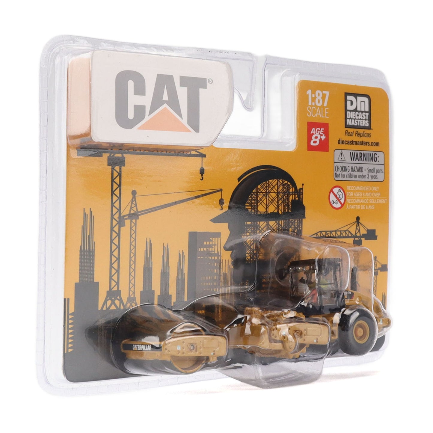 A 1:87 scale diecast model of a CAT roller set in its original blister packaging by Decade Masters. The packaging features a yellow and black industrial graphic background with the CAT logo and a warning label.