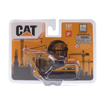 CAT 320D diecast excavator toy in its original blister pack packaging, manufactured by Deco Masters and featuring a 1:87 scale ratio.