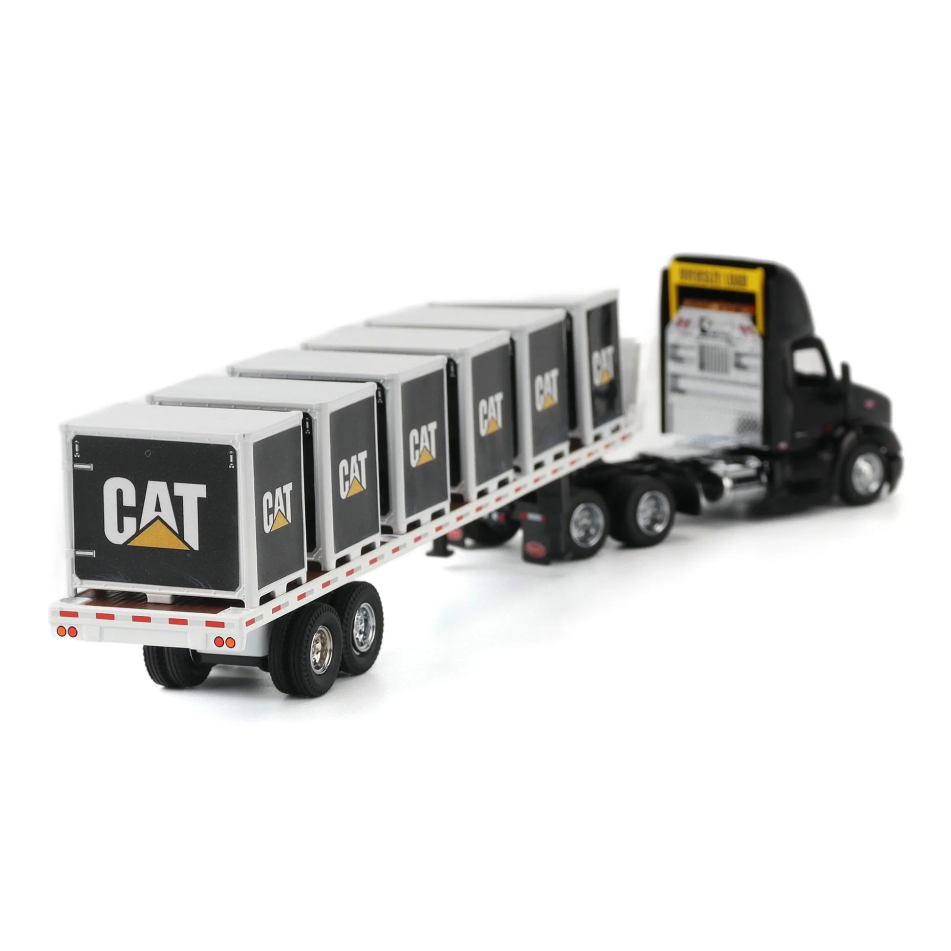Model of a Peterbilt 579 hitched to a flatbed trailer with 6 CAT branded pallet boxes on a white background