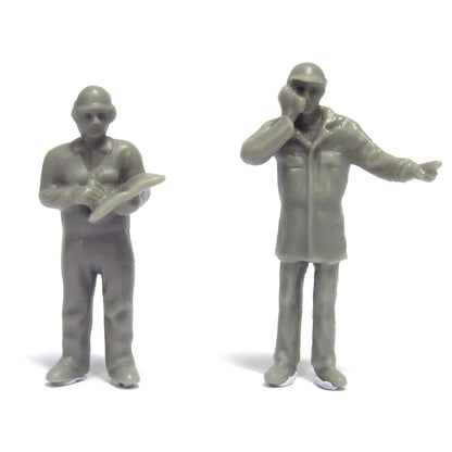 Two gray plastic figures on a white background