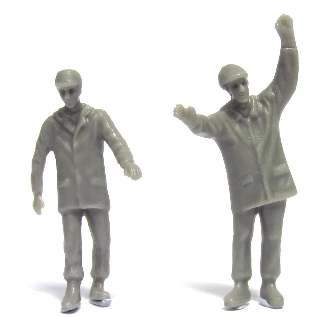 Two gray figure toys on a white background