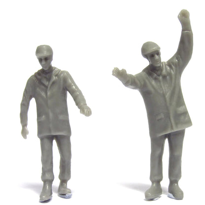 Two gray figure toys on a white background
