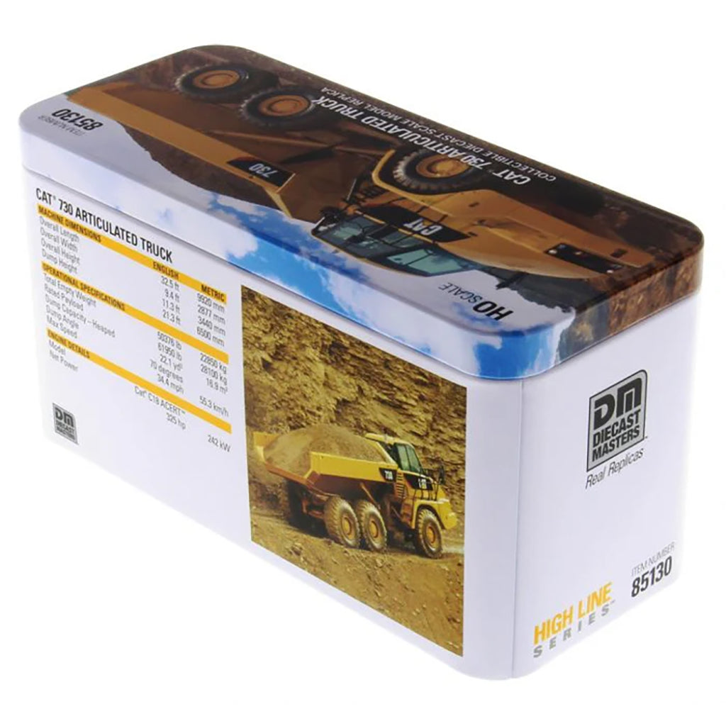 Model of a Caterpillar 730 Articulated Dump Truck in Tin Box Packaging on a White Background