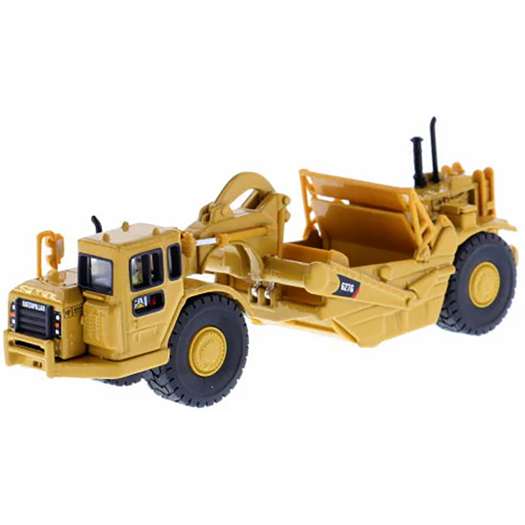 Model of a Caterpillar 627G Wheel Tractor Scraper on a White Background