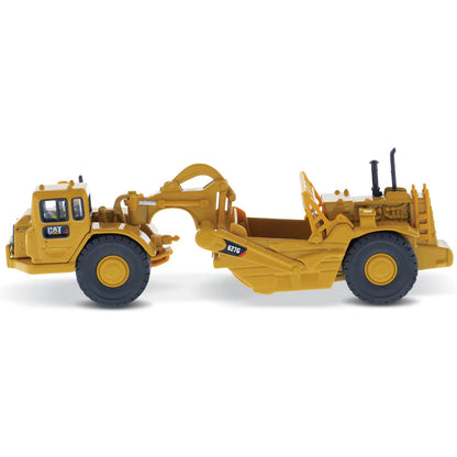 Model of a Caterpillar 627G Wheel Tractor Scraper on a White Background