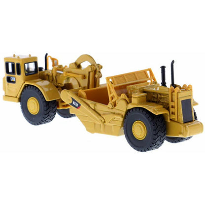 Model of a Caterpillar 627G Wheel Tractor Scraper on a White Background