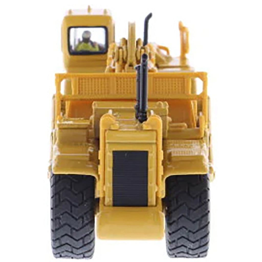 Model of a Caterpillar 627G Wheel Tractor Scraper on a White Background