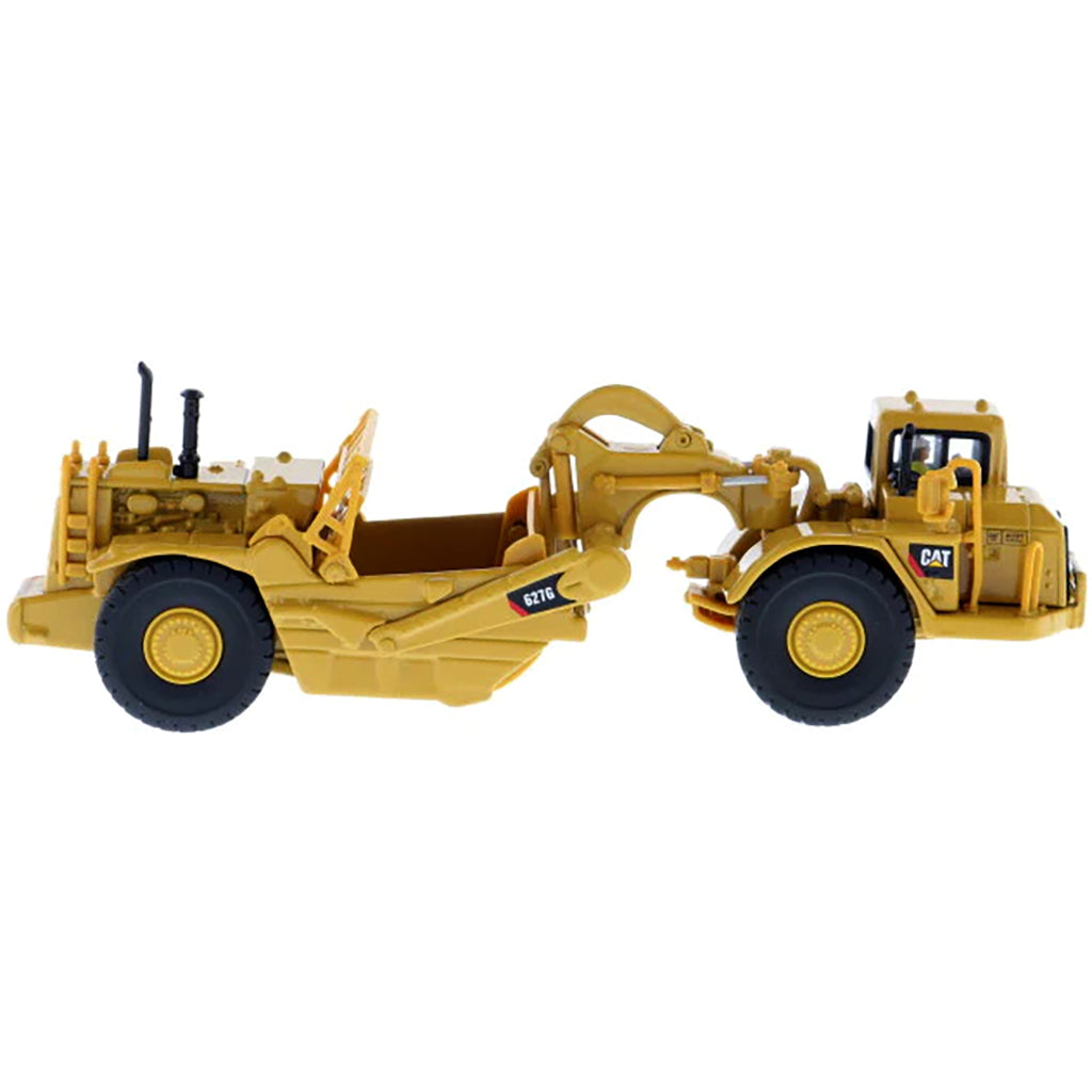 Model of a Caterpillar 627G Wheel Tractor Scraper on a White Background