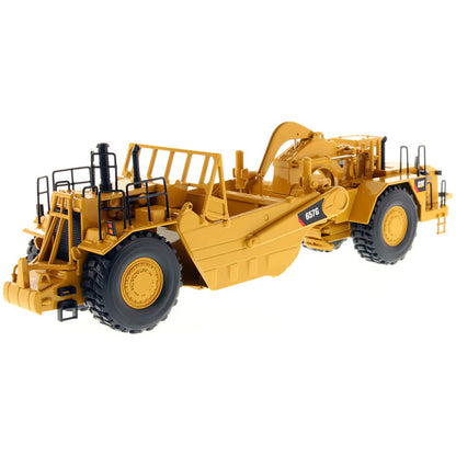 A yellow Caterpillar 657G Wheel Tractor Scraper toy vehicle with black and gray details, part of the High Line Series.