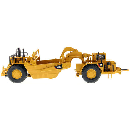 A yellow Caterpillar 657G Wheel Tractor Scraper toy vehicle with black and gray details, part of the High Line Series.