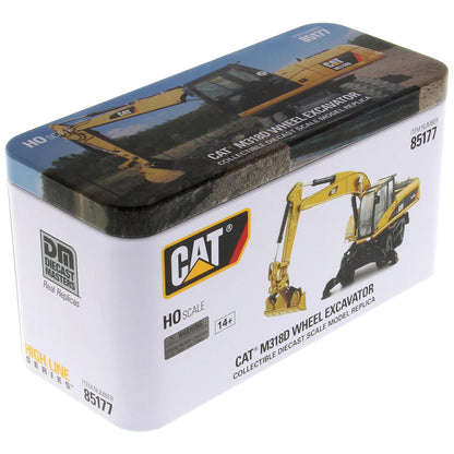 Model of a Caterpillar M318D Wheeled Excavator in Tin Box Packaging on a White Background