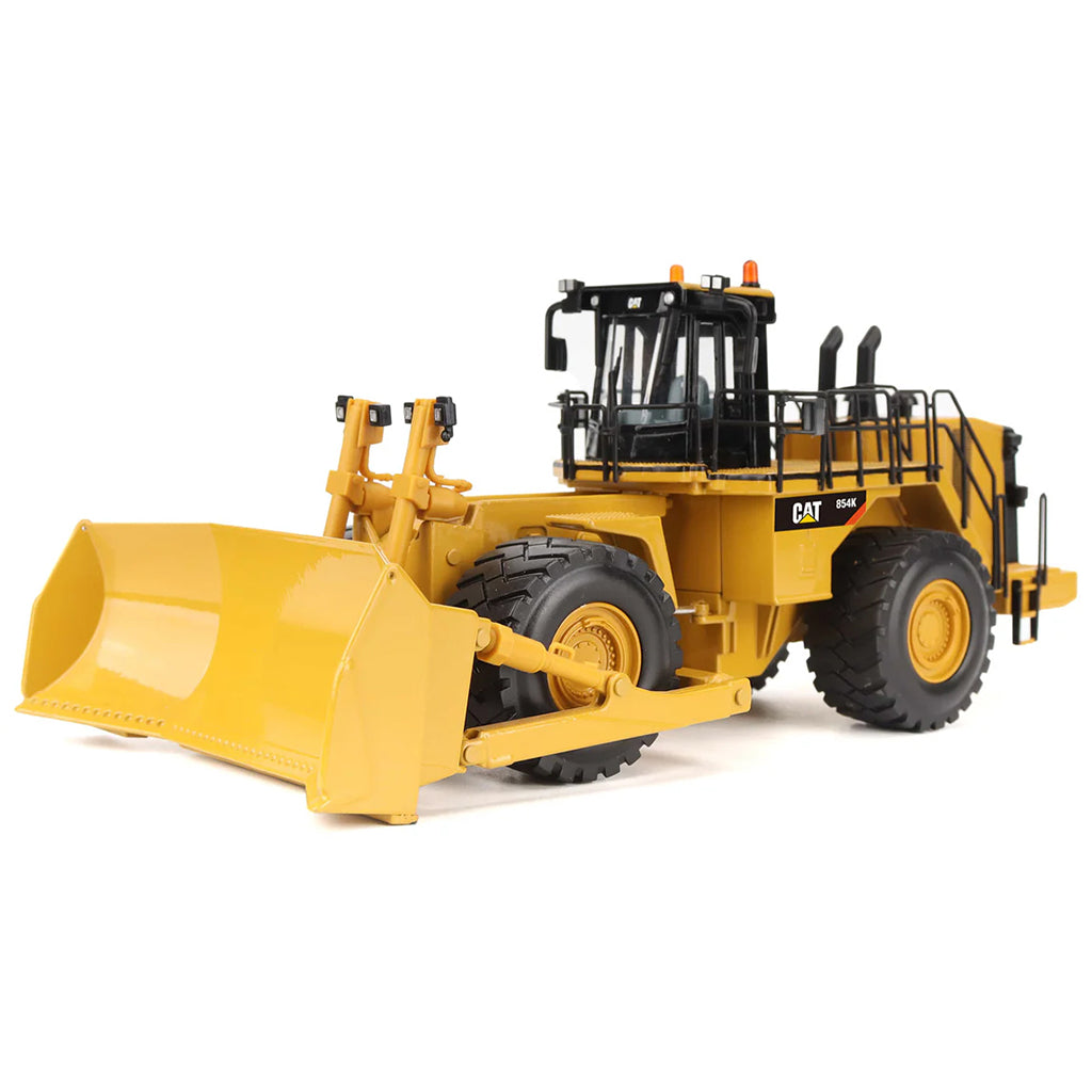 Model of a Caterpillar 854K Wheel Dozer on a White Background
