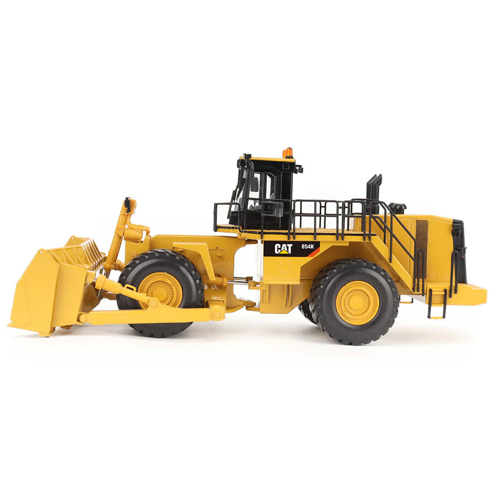 Model of a Caterpillar 854K Wheel Dozer on a White Background