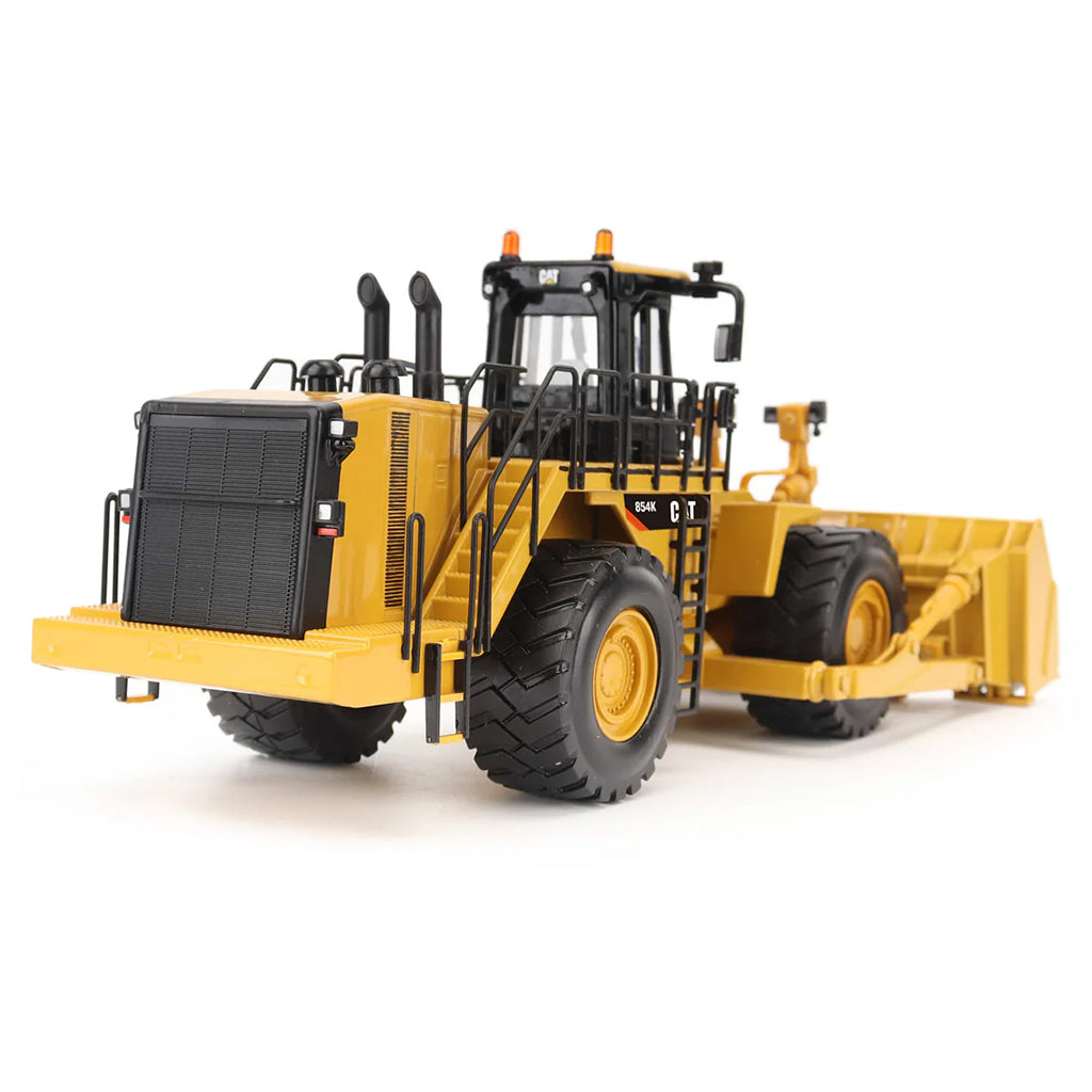 Model of a Caterpillar 854K Wheel Dozer on a White Background