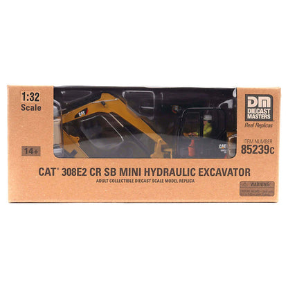 Model of a Caterpillar 302E Mini-Excavator in Brown Cardboard Packaging with a Window to Show the Model on a White Background