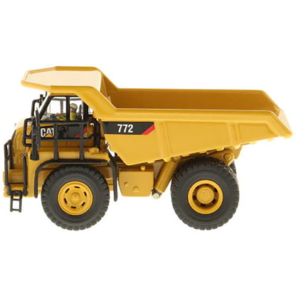 Model of a Caterpillar 772 Off-Highway Dump Truck on a White Background