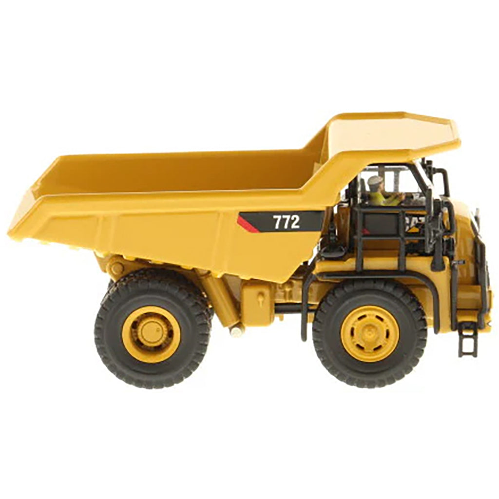 Model of a Caterpillar 772 Off-Highway Dump Truck on a White Background