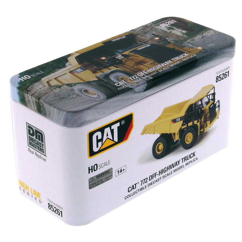 Model of a Caterpillar 772 Off-Highway Dump Truck in Tin Box Packaging on a White Background