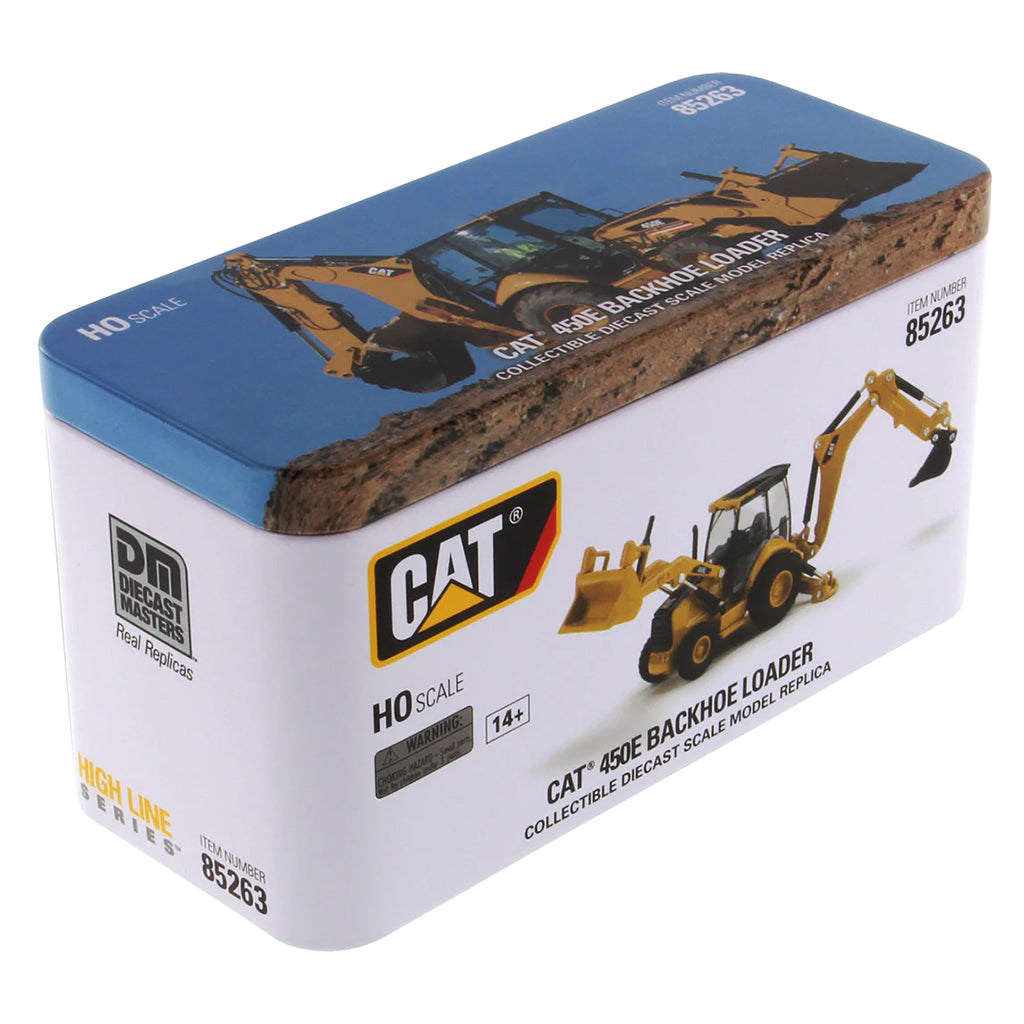 Model of a Caterpillar 450E Backhoe Loader in Tin Box Packaging on a White Background