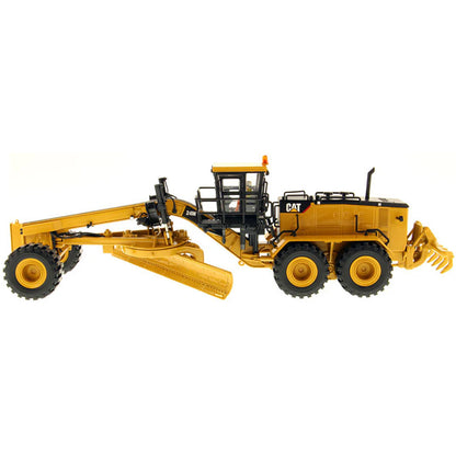 Model of a Caterpillar 24M Road Grader on a White Background
