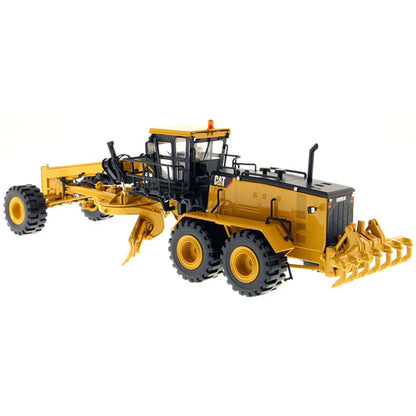 Model of a Caterpillar 24M Road Grader on a White Background