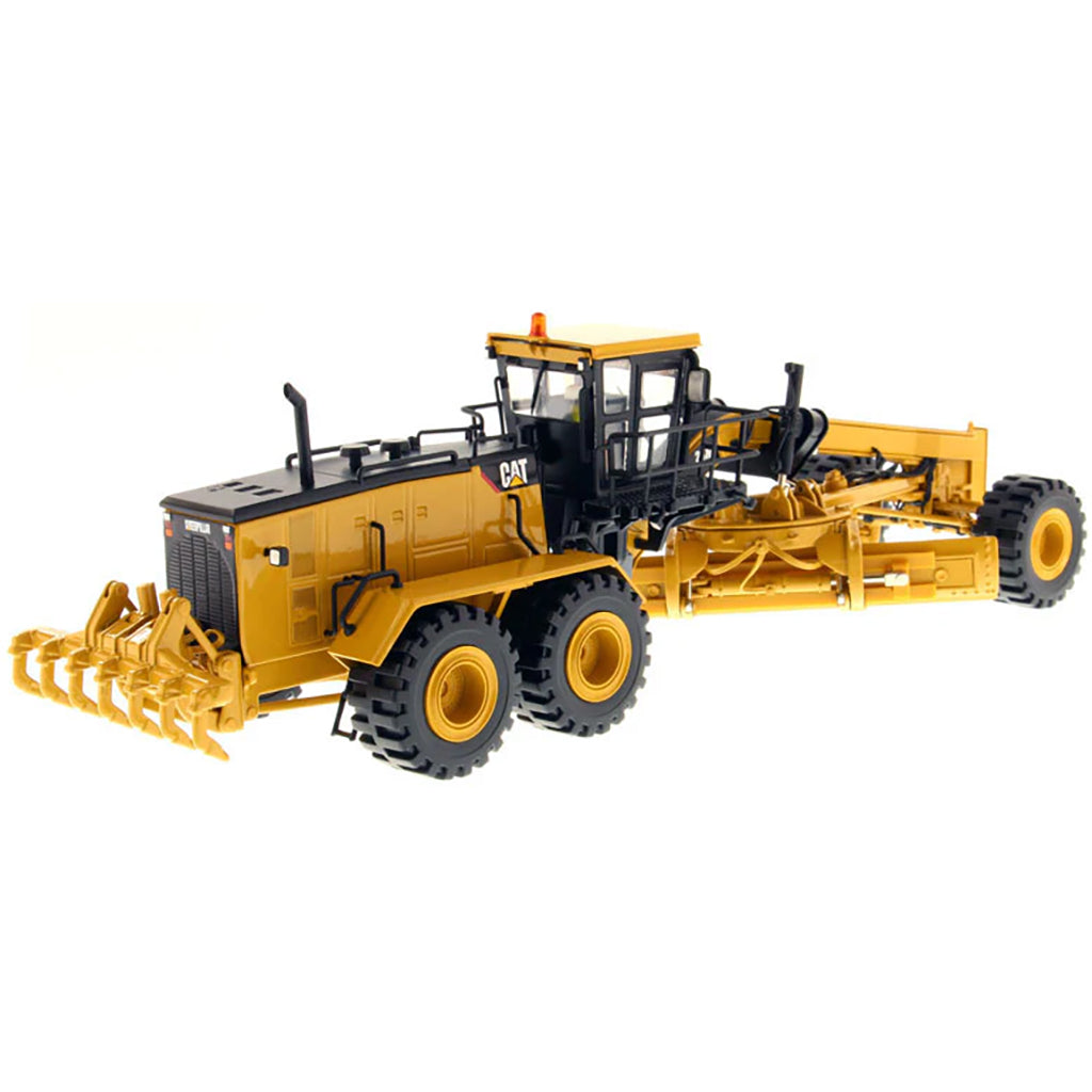 Model of a Caterpillar 24M Road Grader on a White Background