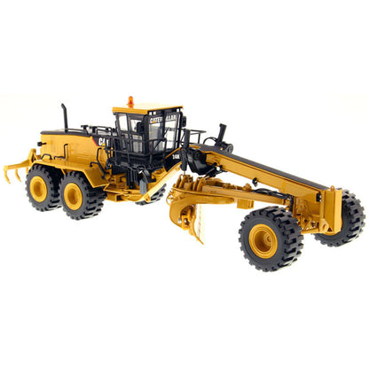Model of a Caterpillar 24M Road Grader on a White Background