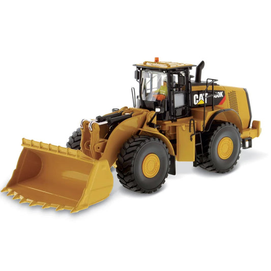 Model of a Caterpillar 980K Wheel Loader with a Rock Configuration on a White Background