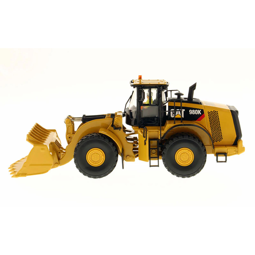 Model of a Caterpillar 980K Wheel Loader with a Rock Configuration on a White Background