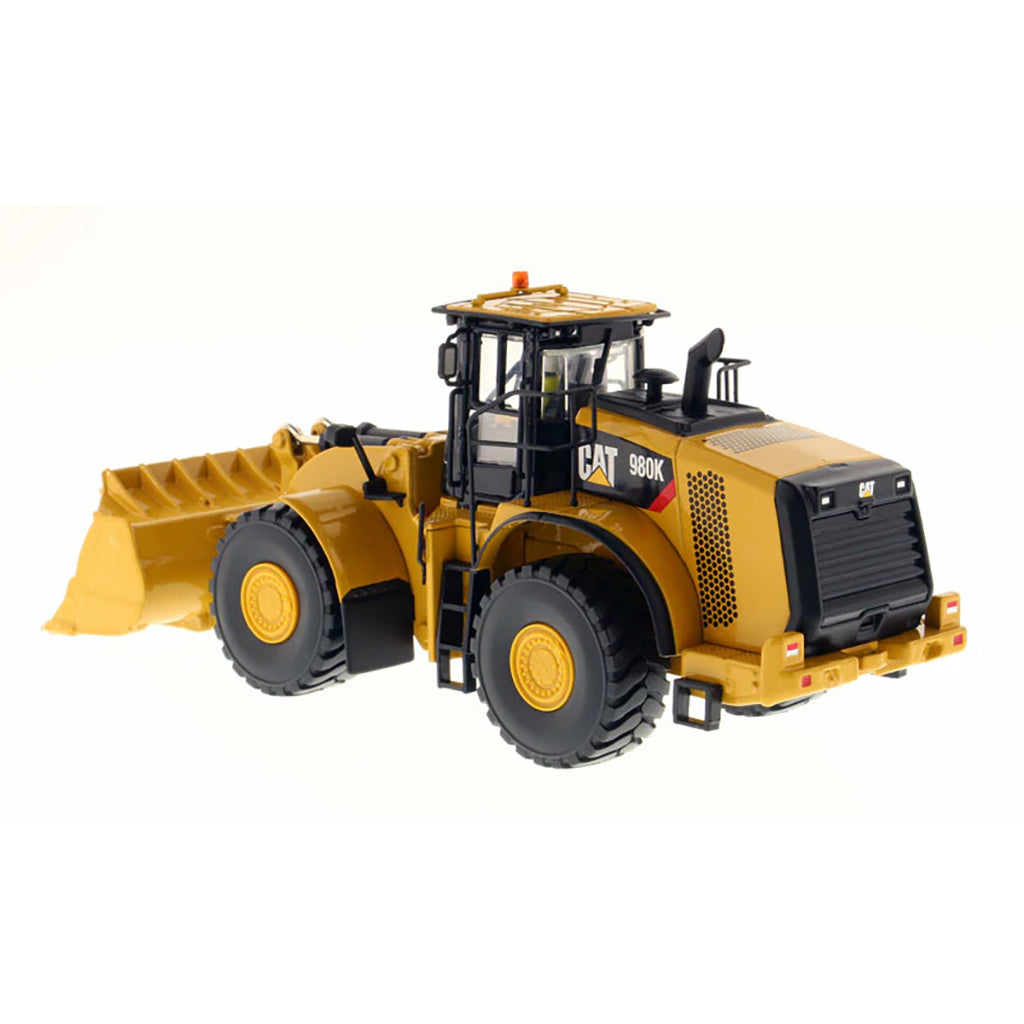 Model of a Caterpillar 980K Wheel Loader with a Rock Configuration on a White Background