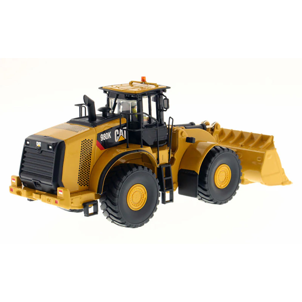 Model of a Caterpillar 980K Wheel Loader with a Rock Configuration on a White Background