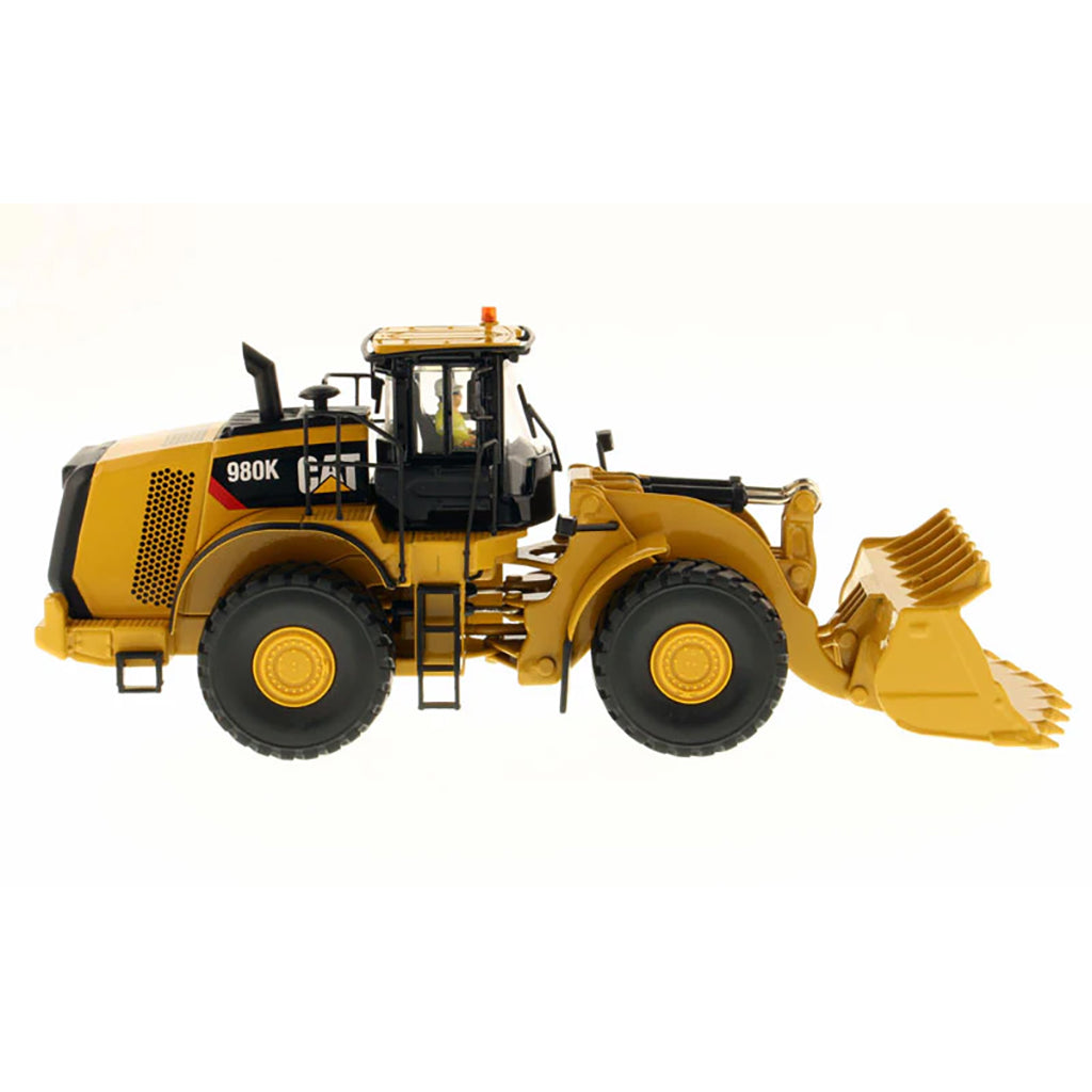 Model of a Caterpillar 980K Wheel Loader with a Rock Configuration on a White Background